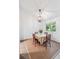 Bright dining room with vaulted ceilings and a charming light fixture creating an inviting space for meals and gatherings at 1142 Village Creek Ln # 4, Mount Pleasant, SC 29464