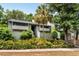 Inviting condo with lush landscaping, palm tree and charming two-story facade, perfect for low-maintenance living at 1142 Village Creek Ln # 4, Mount Pleasant, SC 29464