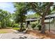 Two-story exterior view surrounded by mature trees and landscaping, creating a welcoming curb appeal at 1142 Village Creek Ln # 4, Mount Pleasant, SC 29464