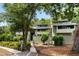 Charming condo with a two-story facade, mature trees, and serene surroundings for a peaceful living experience at 1142 Village Creek Ln # 4, Mount Pleasant, SC 29464