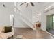 Bright living room with wood floors, modern staircase, and dining area views at 1142 Village Creek Ln # 4, Mount Pleasant, SC 29464