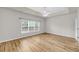 Spacious bedroom with tray ceiling, ceiling fan and large windows to maximize natural light at 1171 Hammrick Ln, Johns Island, SC 29455