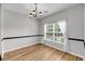 Cozy dining area with natural light, wood flooring and a chandelier at 1171 Hammrick Ln, Johns Island, SC 29455