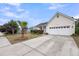 Charming home featuring an attached two-car garage, well-maintained lawn, and manicured landscaping at 1171 Hammrick Ln, Johns Island, SC 29455