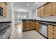 Bright kitchen with stainless steel appliances, black countertops, and ample cabinet space at 1171 Hammrick Ln, Johns Island, SC 29455