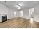 Open living room features wood flooring, a fireplace and an open floor plan at 1171 Hammrick Ln, Johns Island, SC 29455