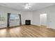 Bright living room with a ceiling fan, hardwood floors, and a fireplace at 1171 Hammrick Ln, Johns Island, SC 29455
