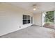 A covered porch featuring a ceiling fan and a view of the surrounding landscape at 1171 Hammrick Ln, Johns Island, SC 29455