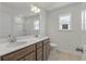 Bathroom featuring double sinks, tile flooring, a large mirror, and modern fixtures at 120 Shingle Oak Dr, Moncks Corner, SC 29461
