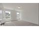 Bedroom with plush carpet, two bright windows, and neutral paint at 120 Shingle Oak Dr, Moncks Corner, SC 29461