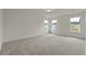 Spacious bedroom with plush carpet, neutral walls, and large windows at 120 Shingle Oak Dr, Moncks Corner, SC 29461