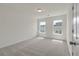 Bright bedroom featuring carpeted floors, neutral walls, and bright windows at 120 Shingle Oak Dr, Moncks Corner, SC 29461