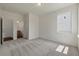 Comfortable bedroom with soft carpet and an adjoining bathroom at 120 Shingle Oak Dr, Moncks Corner, SC 29461