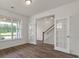 Open foyer with wood-look floors and a staircase visible through glass doors at 120 Shingle Oak Dr, Moncks Corner, SC 29461