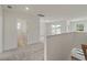 Bright hallway with carpet flooring, white walls, and natural light from windows at 120 Shingle Oak Dr, Moncks Corner, SC 29461