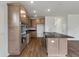 Spacious kitchen with stainless steel appliances, wood cabinets, and a large island at 120 Shingle Oak Dr, Moncks Corner, SC 29461