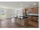 Open kitchen with granite island, stainless steel appliances, and wood cabinets at 120 Shingle Oak Dr, Moncks Corner, SC 29461