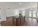 Open-concept kitchen with island, granite counters, and connection to the living space at 120 Shingle Oak Dr, Moncks Corner, SC 29461