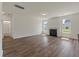 Cozy living room with natural light, featuring wood floors and a fireplace at 120 Shingle Oak Dr, Moncks Corner, SC 29461