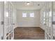 Bright living room with wood floors, white walls, and a modern ceiling light at 120 Shingle Oak Dr, Moncks Corner, SC 29461