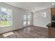 Inviting living room with a light-filled space, hardwood floors and glass doors to the backyard at 120 Shingle Oak Dr, Moncks Corner, SC 29461