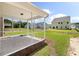 Back patio view of screened in porch. Homes feature expansive green backyards, showcasing community living at 120 Shingle Oak Dr, Moncks Corner, SC 29461
