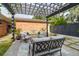 Relaxing backyard patio featuring a pergola, comfortable seating, and stylish outdoor rug at 1251 Charlestowne Dr, Charleston, SC 29407