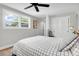 Relaxing bedroom with a patterned comforter, closet and a view of the backyard at 1251 Charlestowne Dr, Charleston, SC 29407