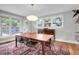 Dining room featuring natural light and hardwood floors, modern lighting and dining set at 1251 Charlestowne Dr, Charleston, SC 29407