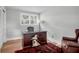 Bright home office with hardwood floors, large window, stylish desk, and comfortable chair at 1251 Charlestowne Dr, Charleston, SC 29407