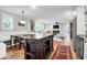 View of the kitchen island looking into the open-concept living room and fireplace at 1251 Charlestowne Dr, Charleston, SC 29407
