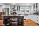 Bright kitchen featuring stainless steel appliances and white cabinets, and island sink at 1251 Charlestowne Dr, Charleston, SC 29407