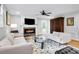 Bright living room with fireplace, modern sofas, and unique coffee table at 1251 Charlestowne Dr, Charleston, SC 29407