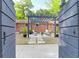 Beautiful outdoor patio with pergola, comfortable seating, and lush landscaping at 1251 Charlestowne Dr, Charleston, SC 29407