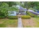 Aerial view of a charming home with a covered front porch and mature landscaping at 1259 Wisteria Rd, Charleston, SC 29407