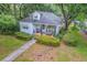 Aerial view of a charming home with a covered front porch and mature landscaping at 1259 Wisteria Rd, Charleston, SC 29407