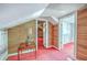 Bedroom with an accent wall, doors to other rooms, and red patterned carpet at 1259 Wisteria Rd, Charleston, SC 29407