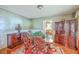 Traditional dining room with vintage wallpaper and hardwood floors at 1259 Wisteria Rd, Charleston, SC 29407