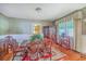 Traditional dining room with vintage wallpaper and hardwood floors at 1259 Wisteria Rd, Charleston, SC 29407