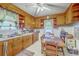 Cozy eat-in kitchen with wood cabinets, a ceiling fan and ample counter space at 1259 Wisteria Rd, Charleston, SC 29407