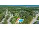 Aerial view of community featuring mature trees, community pool, and well-maintained landscaping at 1315 Palm Cove Dr, Charleston, SC 29492