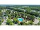 Scenic aerial view of a charming neighborhood featuring mature trees, community pool, and Gathering-friendly amenities at 1315 Palm Cove Dr, Charleston, SC 29492