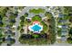 Aerial view of a neighborhood featuring community pool, clubhouse, playground and mature landscaping at 1315 Palm Cove Dr, Charleston, SC 29492