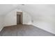 Finished attic boasts carpet, access door, neutral paint, and ample space for storage or flexible use at 1315 Palm Cove Dr, Charleston, SC 29492