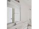 Bathroom vanity with double sinks, large mirror, and chrome fixtures at 1315 Palm Cove Dr, Charleston, SC 29492