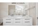 Bright bathroom features a double sink vanity, modern lighting, and a large mirror at 1315 Palm Cove Dr, Charleston, SC 29492