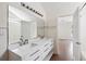 Stylish bathroom with a double sink, modern vanity, and access to the bright, open bedroom at 1315 Palm Cove Dr, Charleston, SC 29492