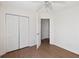Spacious bedroom with hardwood floors, a ceiling fan, and large closet at 1315 Palm Cove Dr, Charleston, SC 29492