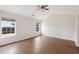Spacious bedroom with hardwood floors, ample natural light, and a modern ceiling fan at 1315 Palm Cove Dr, Charleston, SC 29492