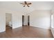 Bright and airy bedroom featuring wood floors and convenient access to the ensuite bathroom at 1315 Palm Cove Dr, Charleston, SC 29492